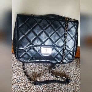 Faux leather mock-Chanel shoulder bag. Black quilted outer, black interior.